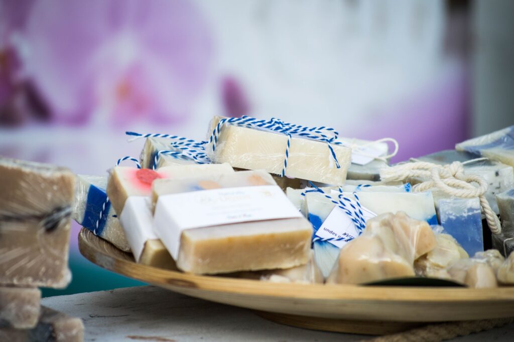 Handmade soaps in wooden dish.
