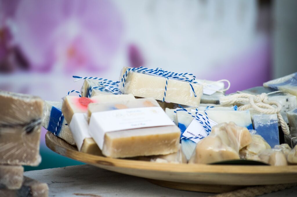 Handmade soaps in wooden dish. 