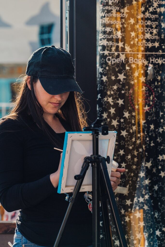 Victoria Petchey paints on her easel at the launch of Beach Street Felixstowe